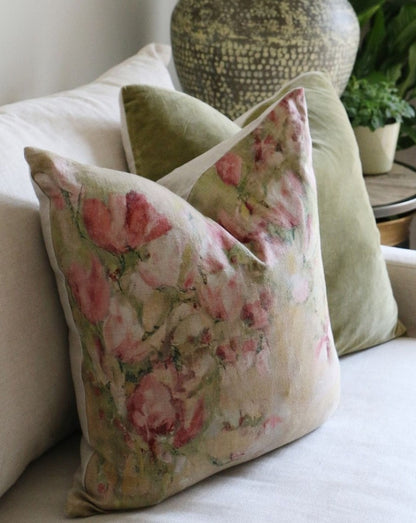 The Magnolia Floral Limone Linen Cushion celebrates the beauty of Spring with its vibrant pink magnolia flowers on a 100% linen background. An ideal addition to any home, this cushion is perfect for bringing life and style to any room. Comes complete with a luxurious feather filled insert. Side.