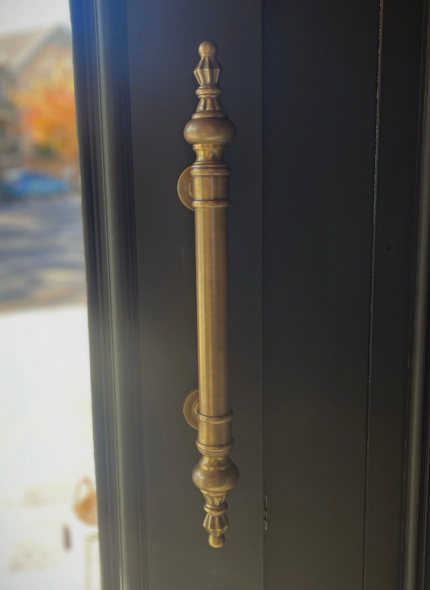 Created from hand-refined, solid brass the Marais Brass Door Pull presents exquisite ornamental finials and round shapes to elevate the aesthetics of any door. Styled.