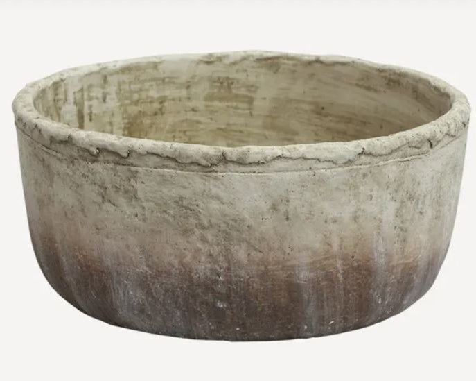 Round stone bowl on a white background