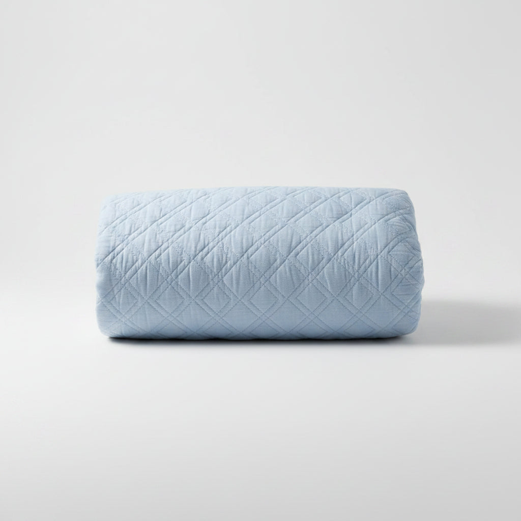 The Marseilles Double Diamond 100% cotton quilt exudes both comfort and style. Featuring an elegant soft blue tone and timeless pattern with intricate cross stitching, it's sure to add a touch of elegance to your bedroom. Crafted with soft and luxurious 100% cotton fabric and wadding, it's also conveniently machine washable on a delicate cycle.