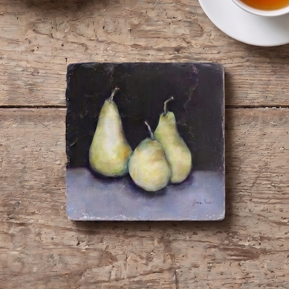 Vintage-style table setting with a coaster featuring green pears.  