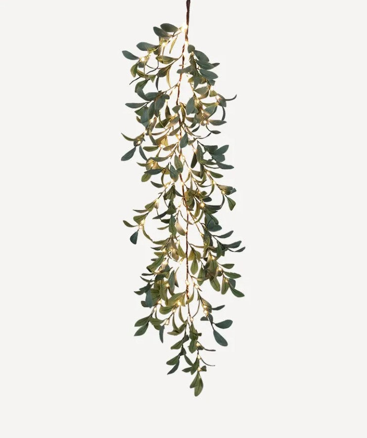 Lush and graceful, the Faux Olive Light Up Garland offers a timeless look with a unique, whimsical twist. Constructed from high-quality materials, this piece provides a realistic effect of olive branches while boasting a 100 LED chain lights for added warmth and illumination. Perfect for your décor, this garland looks stunning on a staircase, mantle, or along the dinner table.