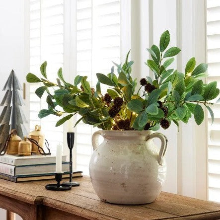 This Large Faux Olive Light Up Branch is a luxurious addition to any home. 15 LED lights adorn the lovely faux greenery, creating an elegant and timeless look that adds a unique touch to any décor. Perfect for vases or pots, it will add a special ambiance to your space. Styled.