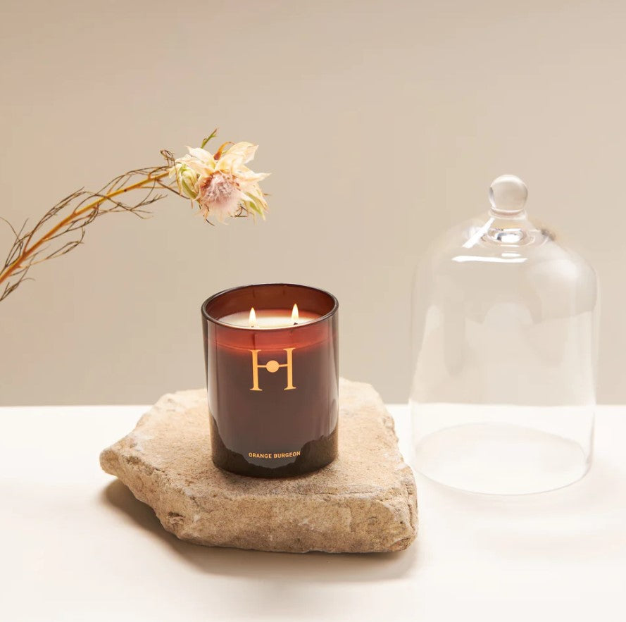 Experience the elegance of our Orange Burgeon candle, featuring soft citrus and herbaceous basil undertones, creating a fresh and uplifting ambience.  When burning this candle top notes of lime zest and mandarin peel will fill your space along with heart notes of basil leaf and thyme and base notes of jasmine, cyclamen and amber. Combined, its unique scent is a mix of floral and citrus fragrances with warm undertones of basil with a peppery, minty edge.