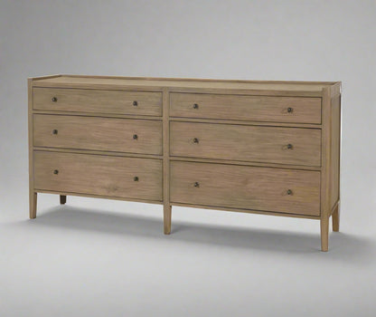 Wooden dresser with four drawers on a white background