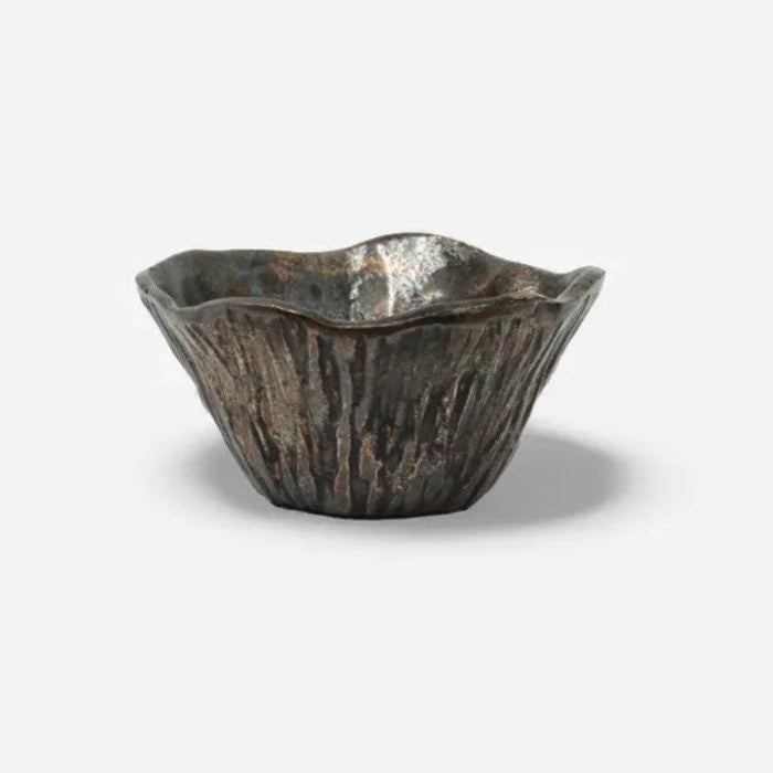 Decorative metal bowl on a white background