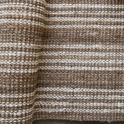 This beautiful Osborne Stripe Jute Mat is hand-crafted from eco-friendly and sustainable jute fibres, providing a unique and stylish addition to your decor. Its natural and white-washed striped boucle weaving provides a sophisticated and stylish visual that won't overwhelm the space. 