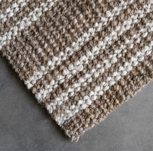 This beautiful Osborne Stripe Jute Mat is hand-crafted from eco-friendly and sustainable jute fibres, providing a unique and stylish addition to your decor. Its natural and white-washed striped boucle weaving provides a sophisticated and stylish visual that won't overwhelm the space. 