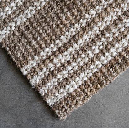 This beautiful Osborne Stripe Jute Mat is hand-crafted from eco-friendly and sustainable jute fibres, providing a unique and stylish addition to your decor. Its natural and white-washed striped boucle weaving provides a sophisticated and stylish visual that won't overwhelm the space. 