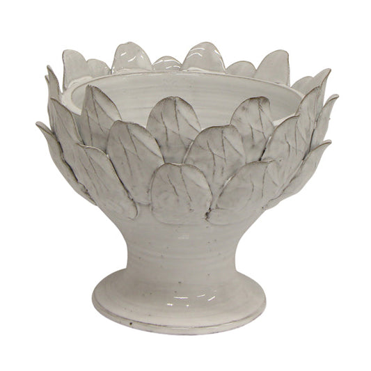 Handcrafted from terracotta and finished with an off-white glaze, this elegant Artichoke Leaf Bowl is the perfect addition to any dining or coffee table, or even a console. Its versatile design makes it equally suitable as a decorative object or a functional serving vessel. 