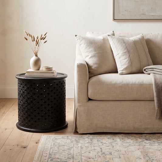 Living room with beige sofa, wooden coffee table, and decorative items.