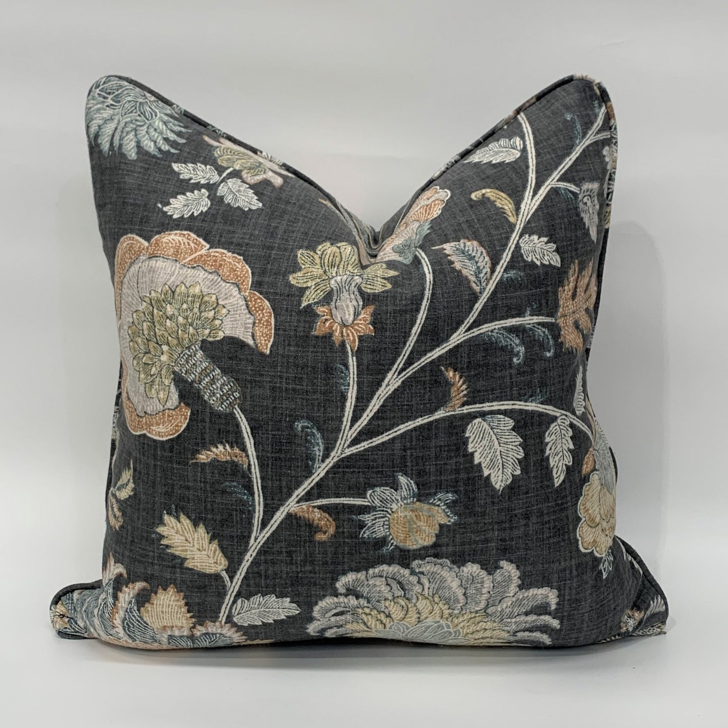 This beautiful Graphite Floral Linen Cushion from Richloom Fabrics is exquisitely crafted from a sumptuous heavyweight fabric. With a soft floral pattern and subtle hues against a dark grey backdrop, it adds a timelessly graceful and elegant touch to any home decor. Includes a luxurious feather insert.