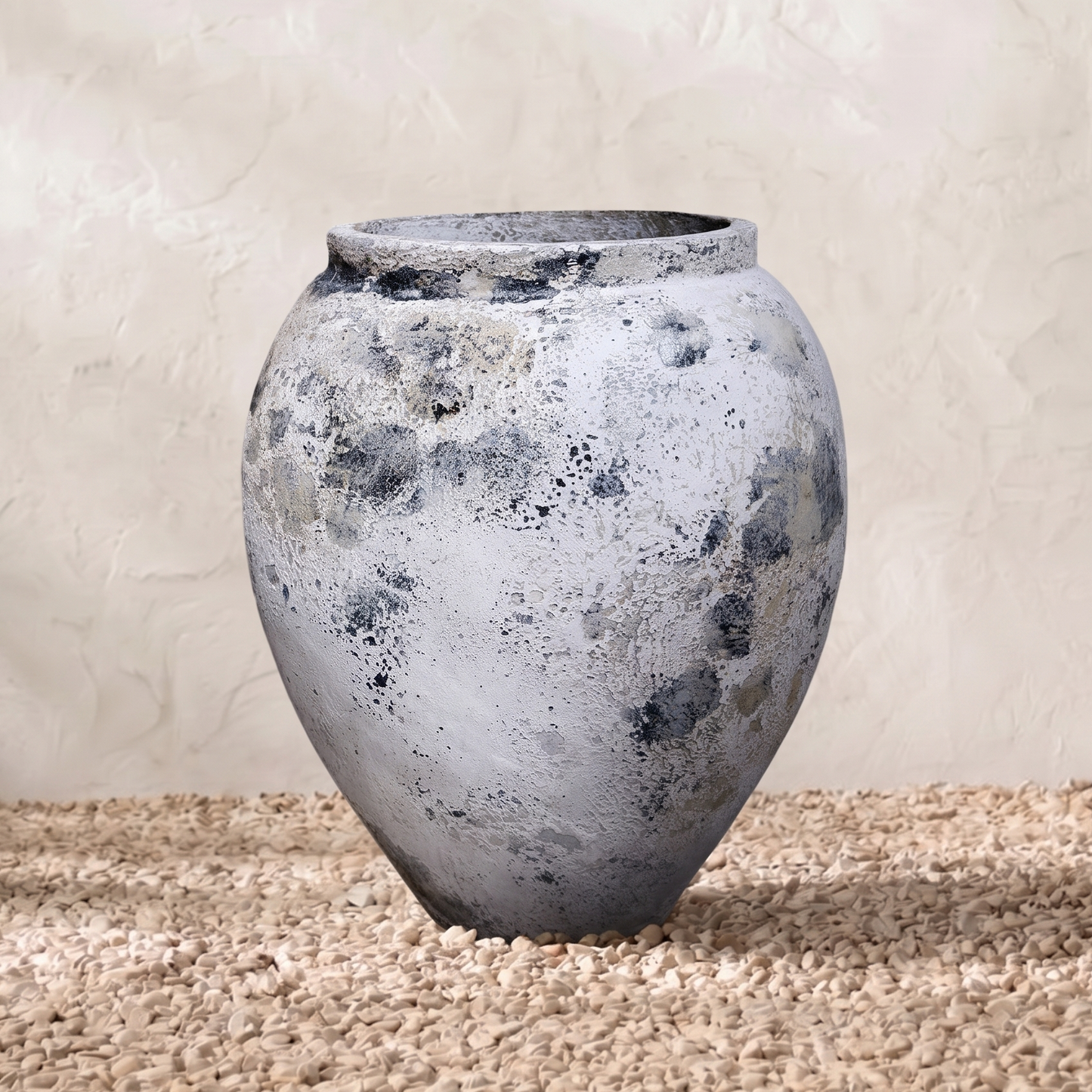 Textured gray vase on a neutral background