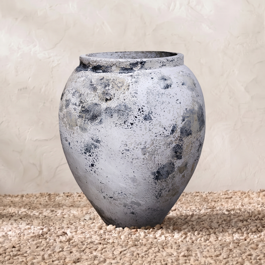 Textured gray vase on a neutral background