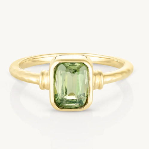 The Romy Apatite Gold Stacker is a real showstopper. It features a gorgeous bezel-set baguette Apatite that catches the light beautifully, with delicate line details on either side. Wear it solo for understated elegance or stack it with other pieces for extra impact.