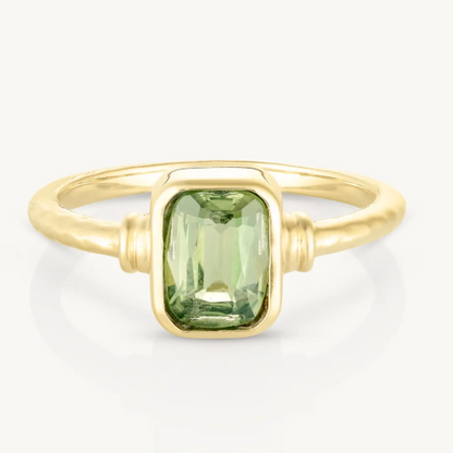 The Romy Apatite Gold Stacker is a real showstopper. It features a gorgeous bezel-set baguette Apatite that catches the light beautifully, with delicate line details on either side. Wear it solo for understated elegance or stack it with other pieces for extra impact.