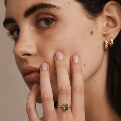 The Romy Apatite Gold Stacker is a real showstopper. It features a gorgeous bezel-set baguette Apatite that catches the light beautifully, with delicate line details on either side. Wear it solo for understated elegance or stack it with other pieces for extra impact.