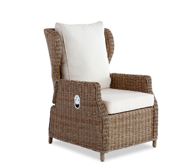 Wicker armchair with white cushions on a white background