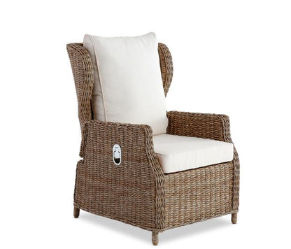 Wicker armchair with white cushions on a white background
