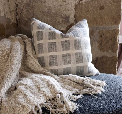 An embodiment of understated elegance, the Chloe Criss-Cross Taupe Linen Cushion is inspired by the cobbles stones of Greece, featuring a luxe weave that captures the eye. Add the matching throw and other pieces from our collection to create a beautiful ensemble, or let the cushion stand on its own. Filled with the exclusive, ultra-comfortable plump feather insert , crafted from linen/cotton yarn dyed check and is OEKO-TEX® and GOTS certified. Styled.