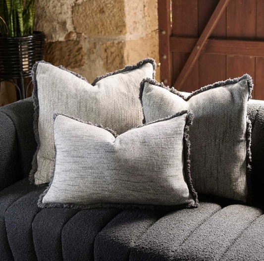 Our Camille Grey Hand-Embroidered Linen Cushion was specifically crafted with meticulous detail and casual living in mind. This muted black cushion with its contrast handcrafted blanket stitch adds a stylish touch to any high-traffic area, providing both durability and comfort. Its exclusive plump feather insert guarantees the most comfortable seating experience, while its 100% linen composition ensure quality. OEKO-TEX® and GOTS certified, this cushion is a smart addition to any space. Lumbar styled.