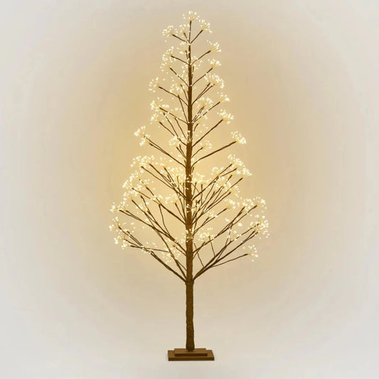 The enchanting LED Christmas Tree stands tall at 180cm and features 1359&nbsp;warm LED lights, Its flexible brown toned branches allow for customizable positioning and its warm glow invites a cozy, inviting atmosphere, perfect for setting a festive mood. Simply plug it in and instantly transform your indoor area into a captivating holiday scene!