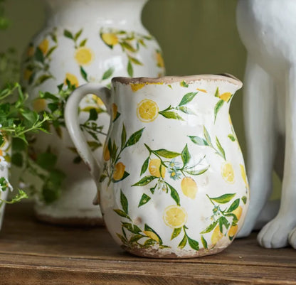 Create a Mediterranean atmosphere in any environment with theSicily Lemon Botanical Stoneware Jug. Handcrafted from durable stoneware and intricately adorned with a delightful lemon pattern, this jug adds a unique and inviting element to indoor and outdoor spaces alike.