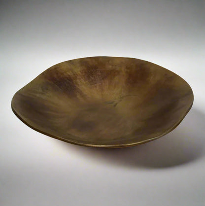 The Alman Decorative Bowl blends rustic appeal with graceful contours, presenting a one-of-a-kind design that makes a statement on tables, consoles, bookcases, or sideboards. Its elegant free-form shape, highlighted by a burnt copper finish, brings a distinctive and captivating element to your interior. Made from aluminium, this bowl is a bold decorative accent that elevates the style of any space with its artistic flair.
