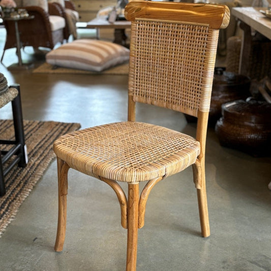 Add understated elegance to your dining table with our Jok Dining Chair handcrafted from solid teak and rattan.