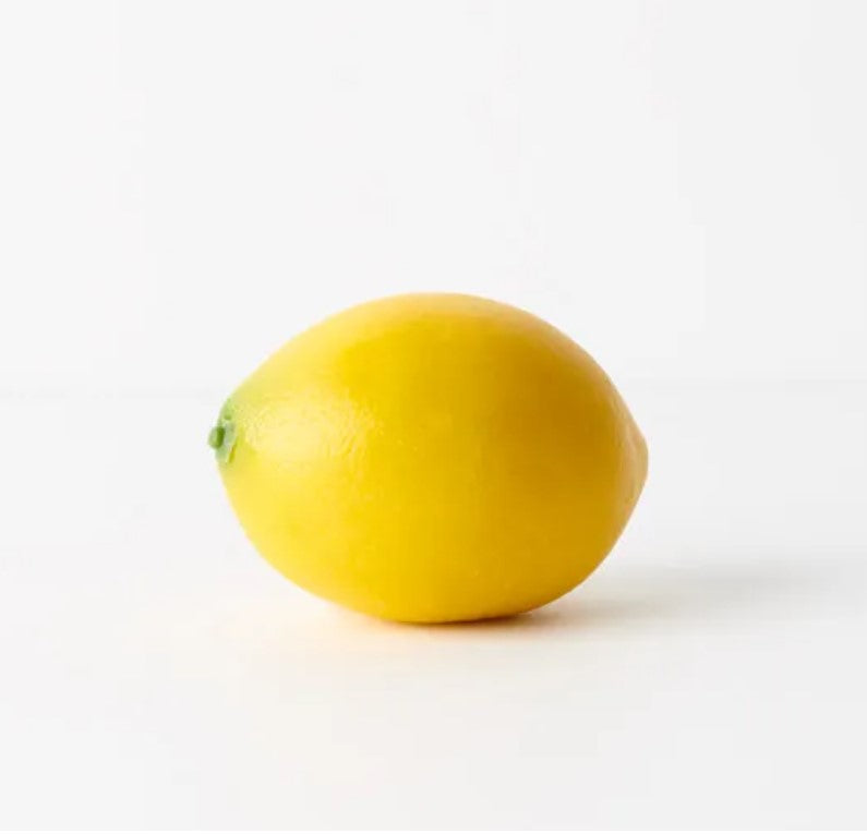 The vibrant Faux Lemon is the perfect option for crafting captivating decorations. Its striking burst of yellow adds a distinctive touch and texture, making it ideal for featuring alone in a bowl or as part of a larger display.