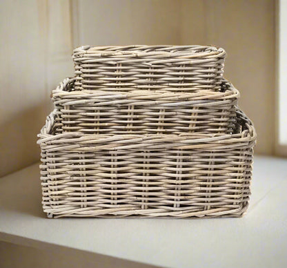 Experience the perfect blend of functionality and design with this versatile classic rattan rectangular basket. Its low, straight sides and strong integrated handles make it both strong and practical.&nbsp;