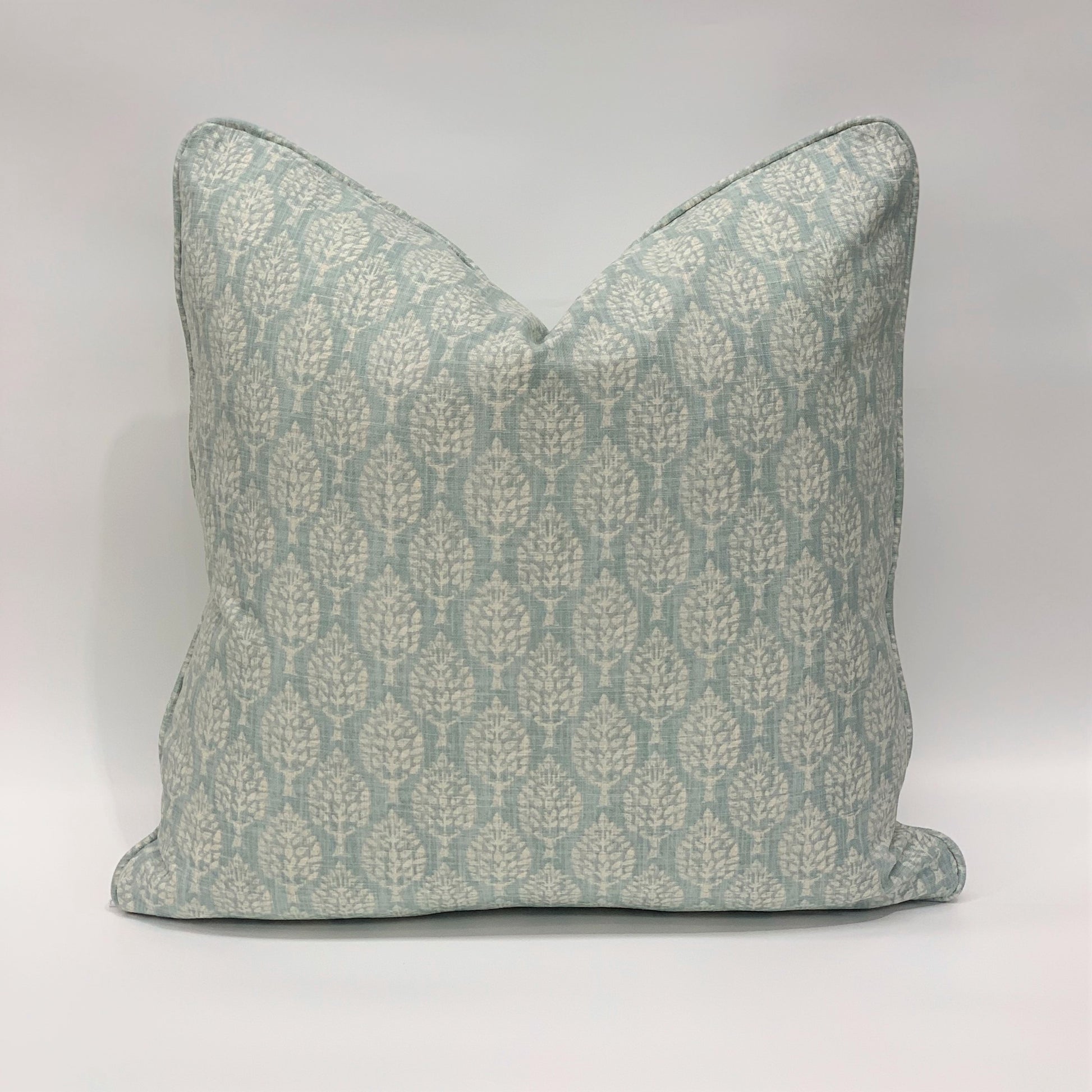 Crafted from Slender Morris' sumptuous heavyweight fabric, this stand-out Aqua Kemble Patterned Cushion displays a light aqua base adorned with delicate pastel tones, creating an elegant and graceful accompaniment to your plush home decor.