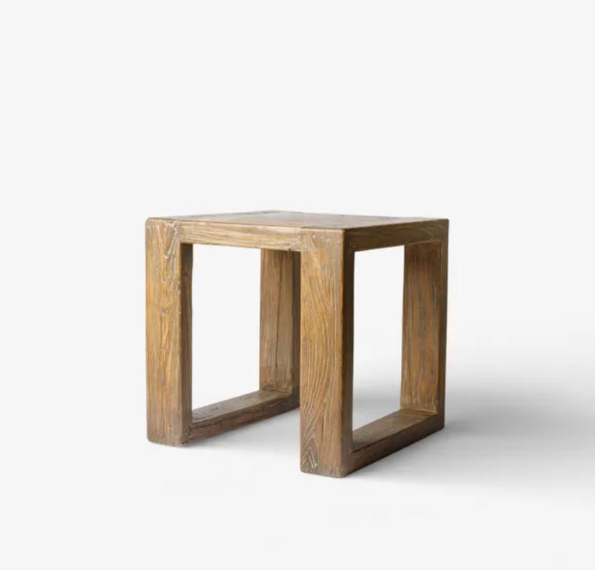 A rustic wooden side table with a square top and thick, open-frame legs, shown on a clean white background.