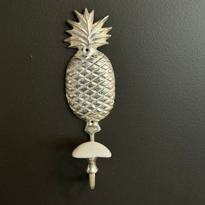 Elevate your home decor with our elegant Silver Pineapple Hook. Perfect for any space, whether it's the entryway, hallway, or bedroom, this charming and functional hook is crafted from high-quality brass and exquisitely finished in silver. Styled.