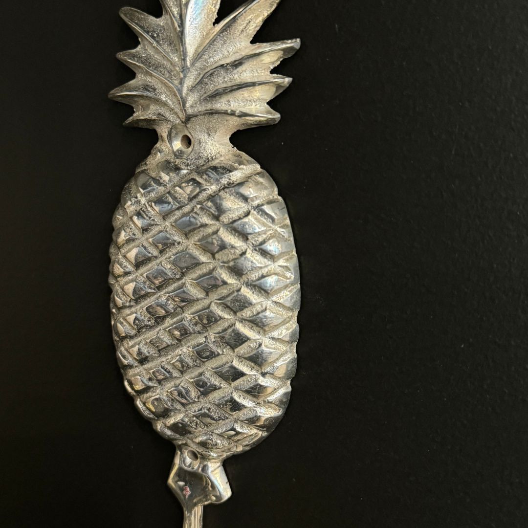 Elevate your home decor with our elegant Silver Pineapple Hook. Perfect for any space, whether it's the entryway, hallway, or bedroom, this charming and functional hook is crafted from high-quality brass and exquisitely finished in silver. Detail.