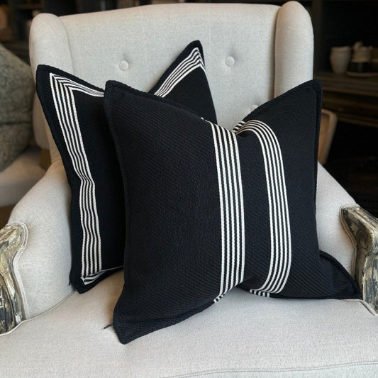 Channeling the sleek elegance of Milano's fashion district, each Black & White Herringbone Striped Cushion features the striking contrast of black and white, evoking the timeless beauty of the marble found in both ancient Italian villas and modern Milanese ateliers. Styled.