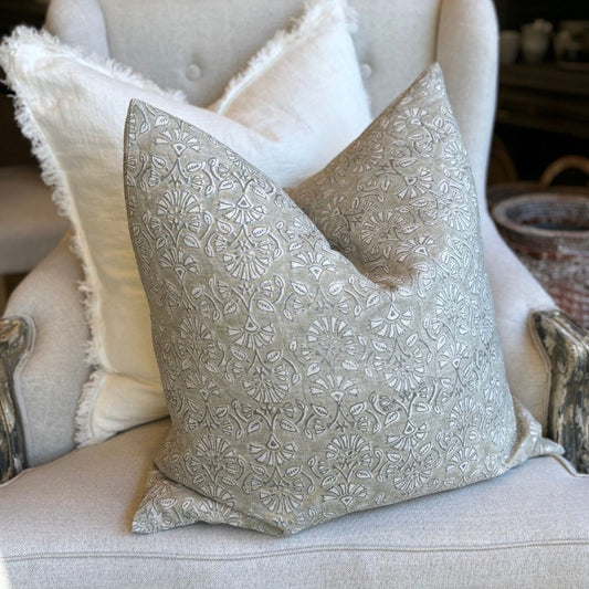 This Sumatra French Linen Light Grey Cushion has been crafted of premium, heavyweight French linen with an artisanal block-printing method to create uneven, textured effects. The light grey exterior features an oatmeal/natural flax linen finish, and comes with a plush feather-filled insert. Styled.