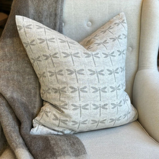 Indulge in the luxury of our Dragon Fly Block Printed Heavy Weight Linen Cushion, featuring a delicate French linen fabric and filled with a soft feather insert measuring 55x55. Its understated light grey tones add an elegant touch to any space.