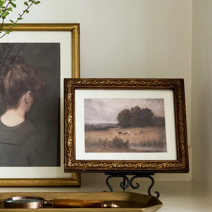 This Vintage Rural Landscape Wall Art has rich tones, layered textures, and a vintage palette giving it a 'collected' look. It is perfect to add to a gallery wall or as a stand alone piece tucked in a moody corner. Set in a decorative antique gold frame.
Dimensions: 25cm L x 2.5cm D x 20cm H