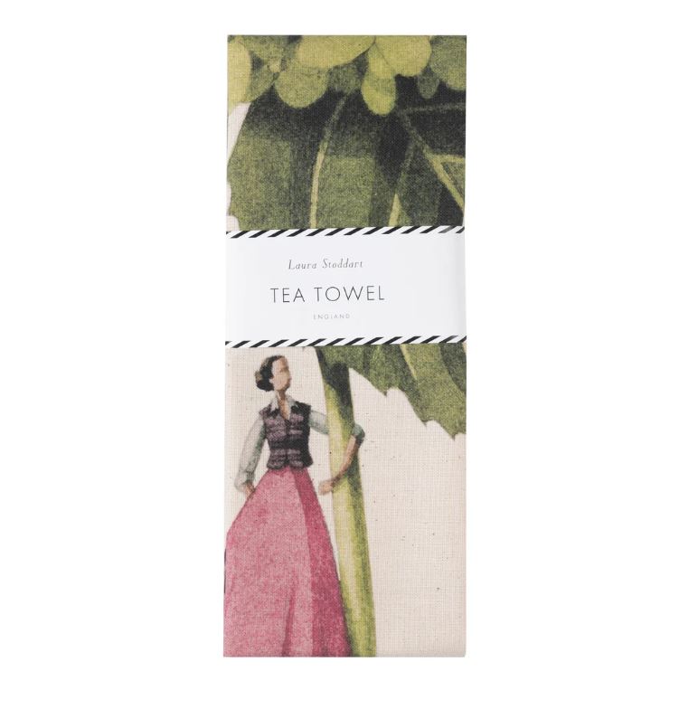 Tea towel packaging with vintage illustration of a woman and green leaves.