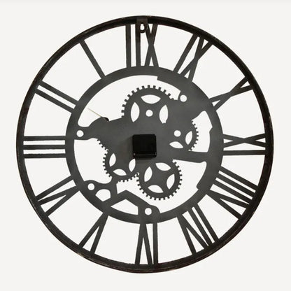 iron wall clock with Roman numeral design on a white background