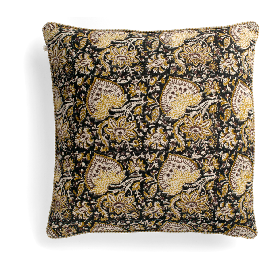 Indulge in the elegance of the Oriental Block Printed Linen Black Cushion, a stunning creation from the esteemed Swedish brand, Chamois. Hand block printed on luxurious 100% Belgian linen, this cushion offers a soft touch and premium quality. Its versatile design seamlessly blends with a variety of colour options, while the chic piped edges add a touch of lavishness. Includes a cozy feather insert. Front.