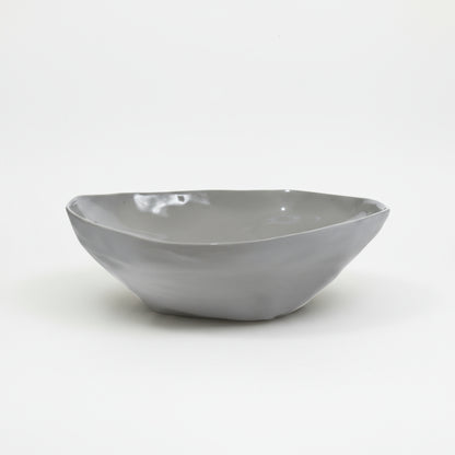 Gray ceramic bowl on a white background
