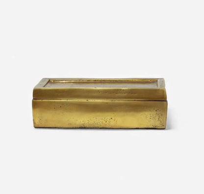 Rectangular brass box with a glass lid on a white background