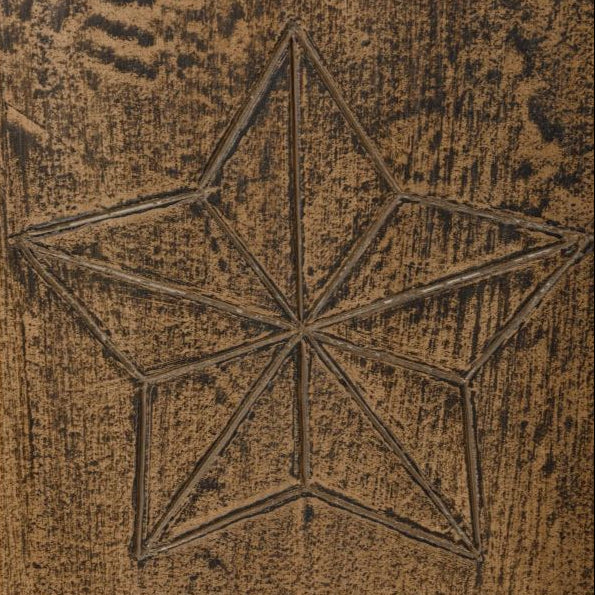 Star-shaped design on a textured brown surface