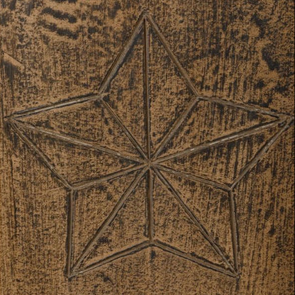 Star-shaped design on a textured brown surface