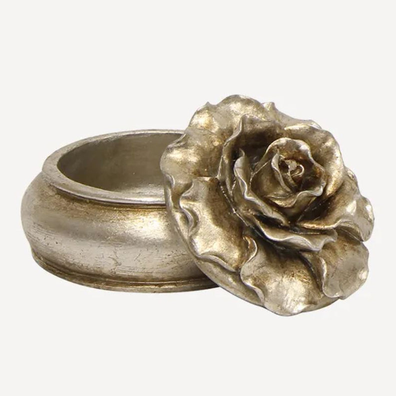 Silver ring with a rose-shaped design on a white background