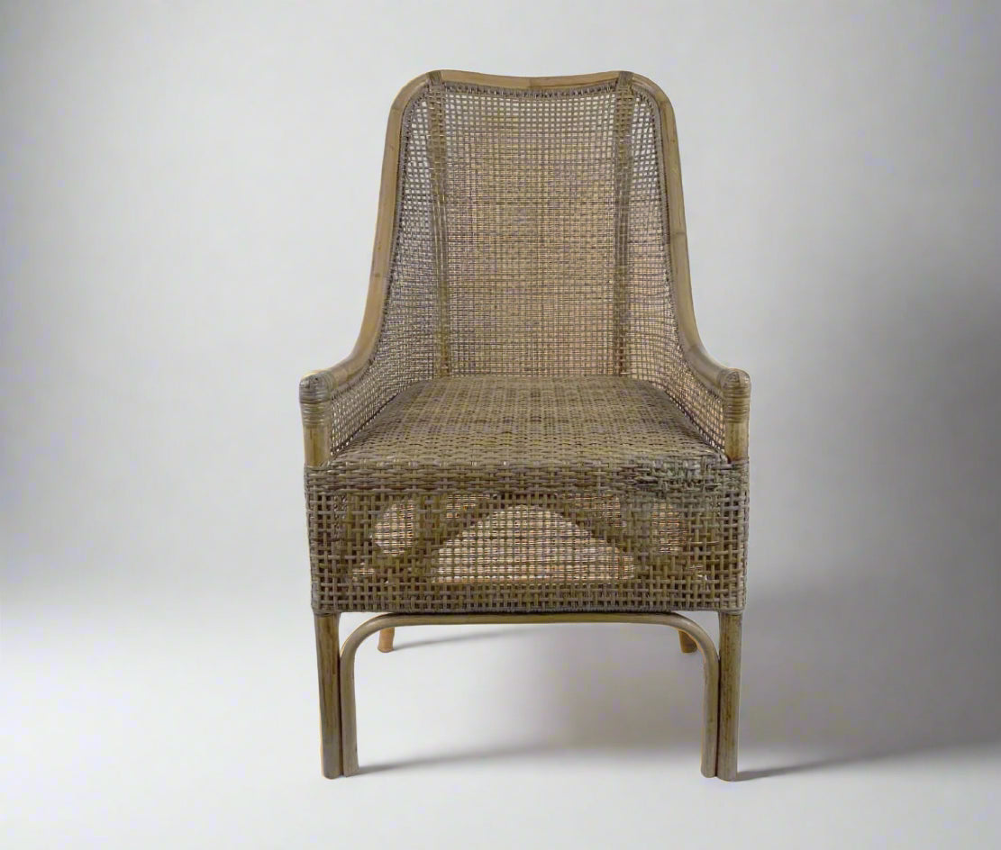 Wicker chair with a textured backrest and seat on a white background