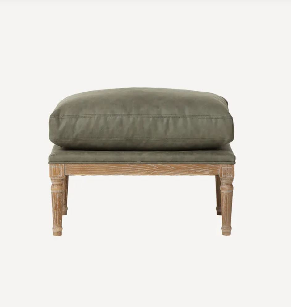 A rustic wooden bench with a thick, cushioned olive green upholstered seat and backrest, shown against a plain light gray background.