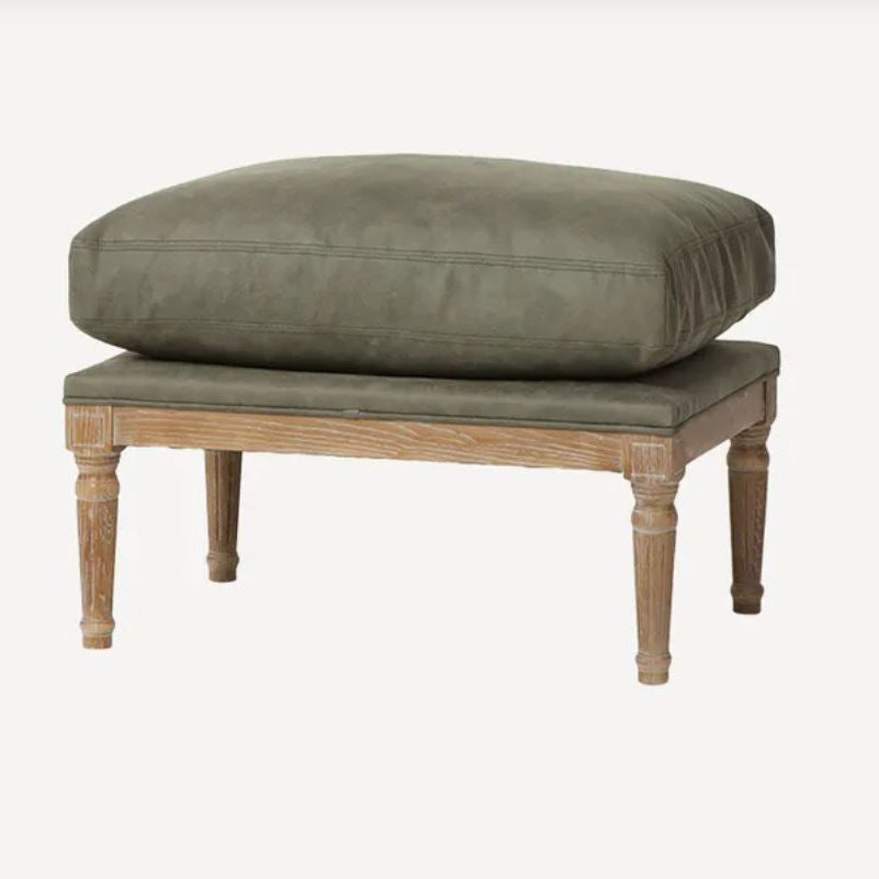 A rustic wooden bench with a thick, cushioned olive green seat and backrest, shown against a plain off-white background.